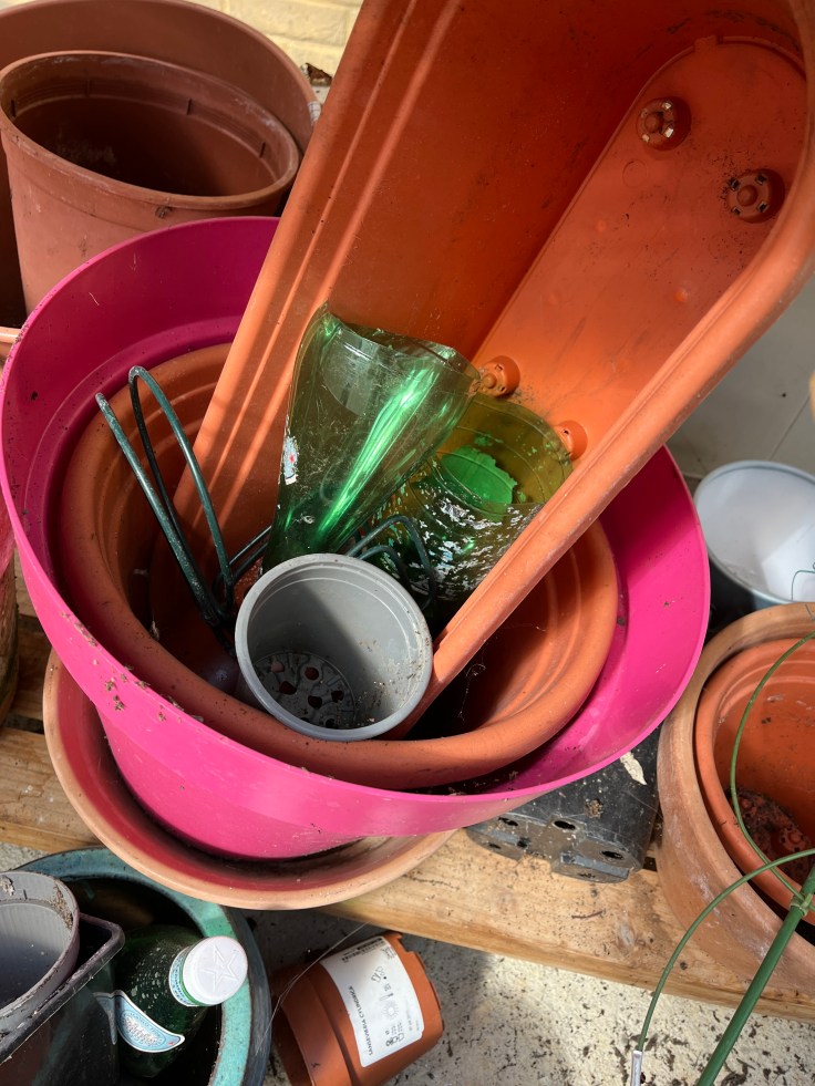 Plastic bottles saved to line the bottom of large containers.